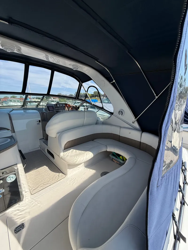 Slide: The Image of Luxurious interior of 2004 Four 328 Vista boat with plush seating and modern design. - 15