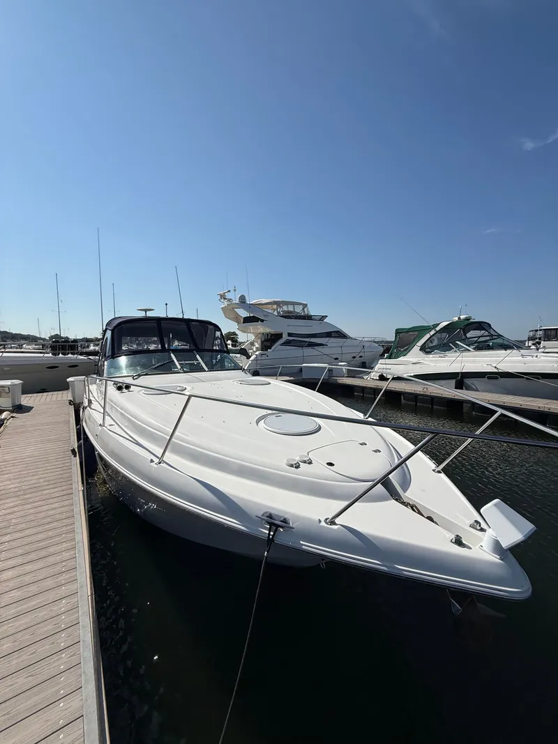 Slide: The Image of 2004 Four 328 Vista boat docked at marina under clear blue sky. - 20