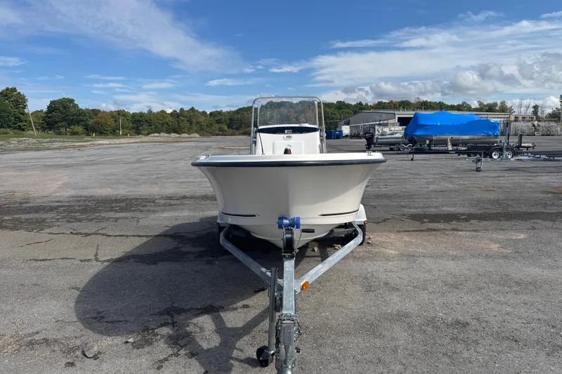 Slide: The Image of 2007 Trophy 1703 Center Console boat on trailer in parking lot. - 1