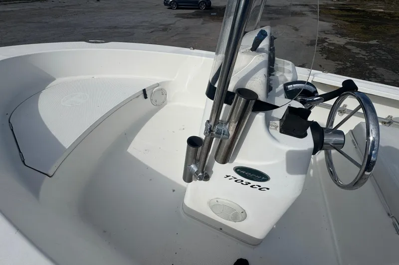 Slide: The Image of 2007 Trophy 1703 Center Console boat interior with steering wheel and rod holders. - 10