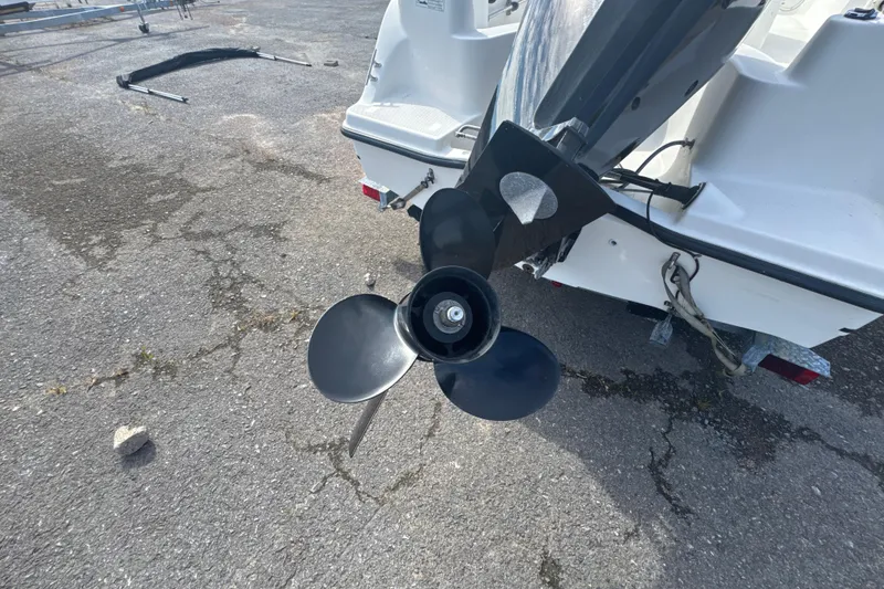 Slide: The Image of Rear view of a 2007 Trophy 1703 Center Console boat propeller on pavement. - 15