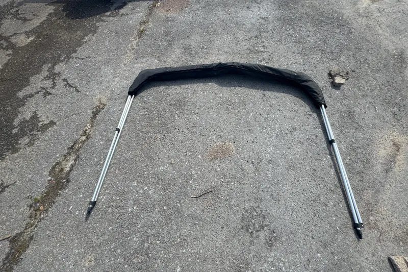 Slide: The Image of Folded bimini top frame on pavement, suitable for 2007 Trophy 1703 Center Console boat. - 16