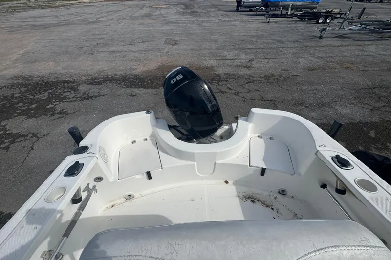 Slide: The Image of 2007 Trophy 1703 Center Console boat with outboard motor on a paved surface. - 5
