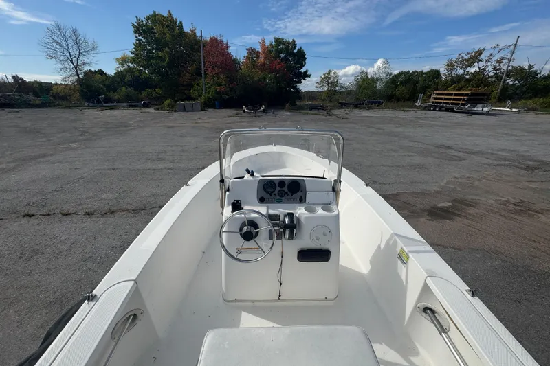 Slide: The Image of 2007 Trophy 1703 Center Console boat in a parking lot, clear sky background. - 7