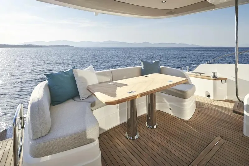 Slide: The Image of Luxurious 2026 Princess F65 yacht deck with elegant seating and ocean view. - 10