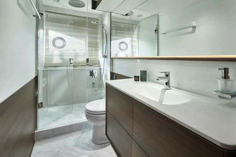 Slide: The Image of Modern bathroom interior on 2026 Princess F65 yacht, featuring sleek design and glass shower. - 15