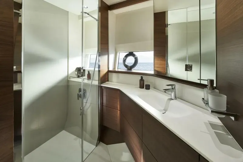 Slide: The Image of Luxurious bathroom in 2026 Princess F65 yacht with modern fixtures and elegant wood accents. - 18