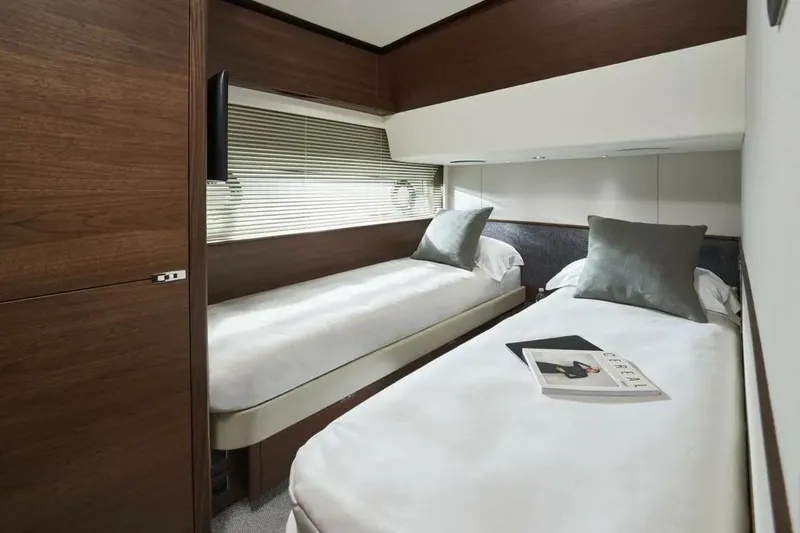 Slide: The Image of Luxurious twin cabin interior of 2026 Princess F65 yacht with modern decor. - 19