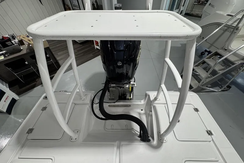 Slide: The Image of 2026 Action Craft 20 Flatsmaster boat deck with storage compartments and cushioned seating. - 17