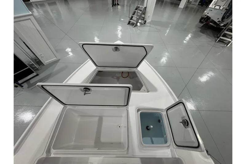 Slide: The Image of 2026 Action Craft 20 FLATSMASTER boat with powerful outboard motor in showroom. - 8