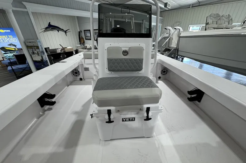 Slide: The Image of 2026 Action Craft 20 Flatsmaster boat engine and transom in a showroom. - 10