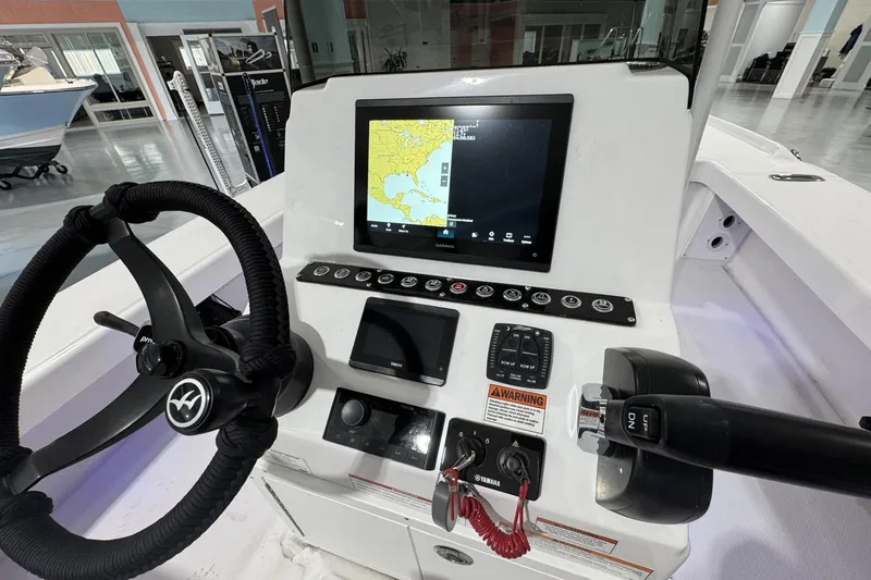 Slide: The Image of 2026 Action Craft 20 Flatsmaster boat deck with storage compartments. - 12