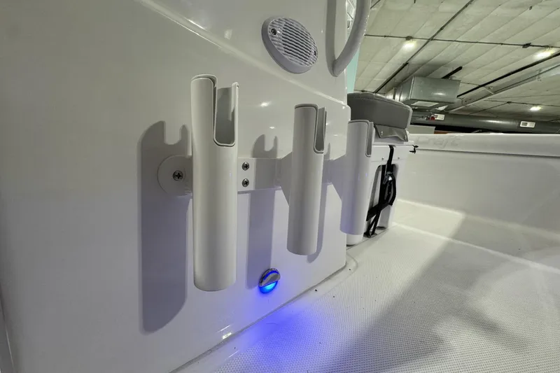 Slide: The Image of 2026 Action Craft 20 Flatsmaster boat interior with Yeti cooler seat in showroom. - 13