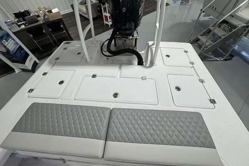 Slide: The Image of 2026 Action Craft 20 Flatsmaster boat seat with quilted gray upholstery and storage compartment. - 14