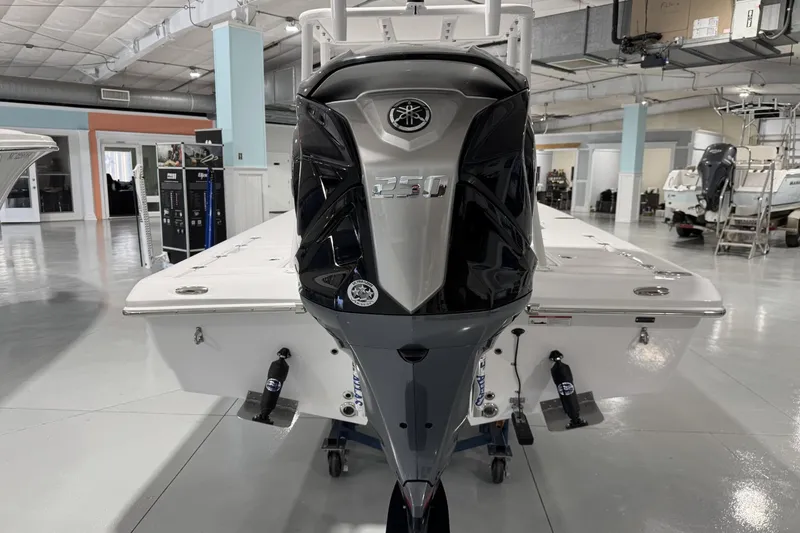 Slide: The Image of 2026 Action Craft 20 Flatsmaster boat displayed in a showroom, front view. - 5