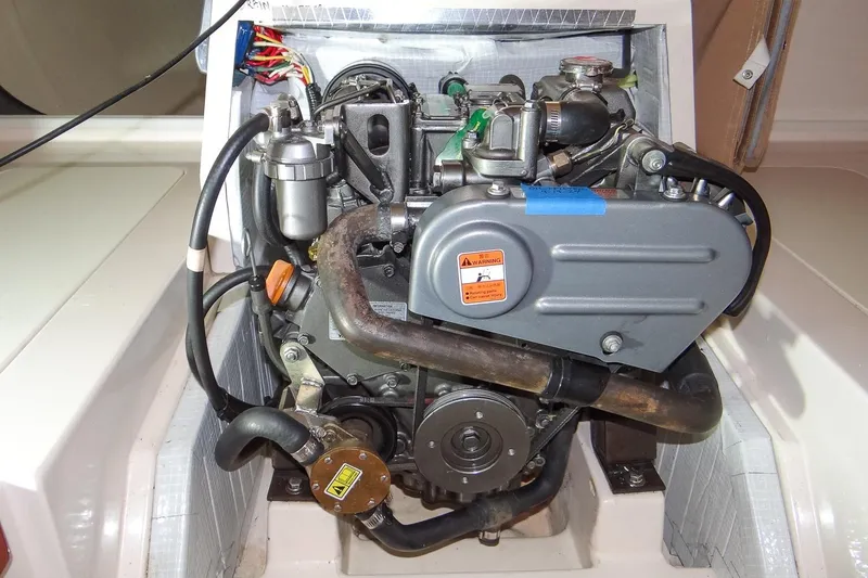 Slide: The Image of Engine compartment of a 2012 Morris Yachts M29 sailboat, showcasing detailed components. - 14