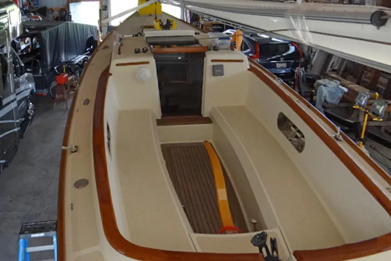 Slide: The Image of 2012 Morris Yachts M29 sailboat interior in a garage setting. - 7