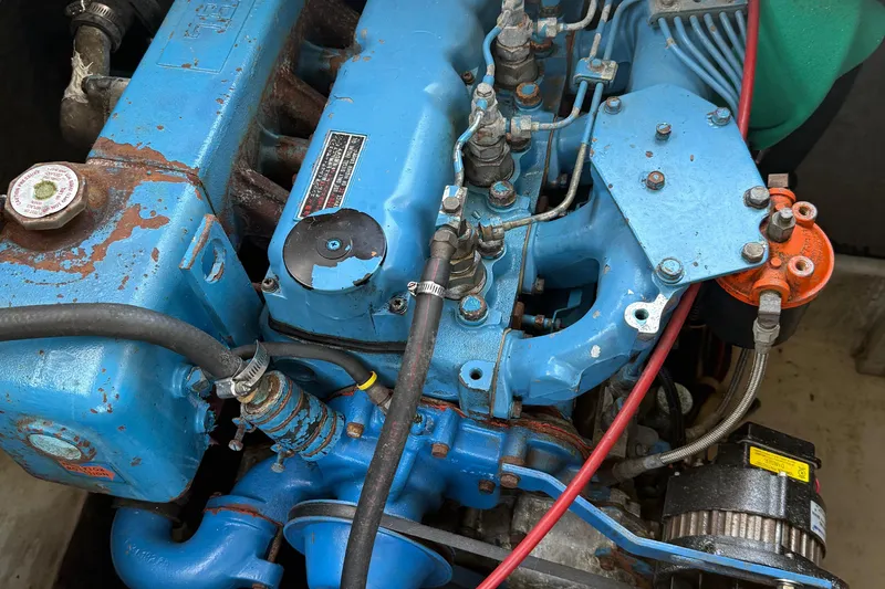 Slide: The Image of Engine of 1983 Bayliner 3870 Motoryacht, showing blue components and wiring. - 17