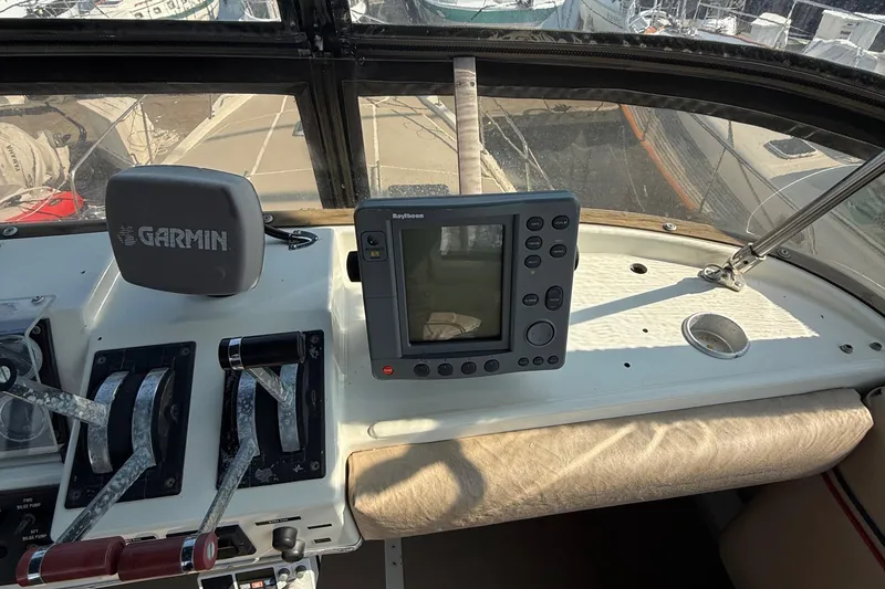 Slide: The Image of Cockpit of 1983 Bayliner 3870 Motoryacht with Garmin and Raytheon navigation equipment. - 5