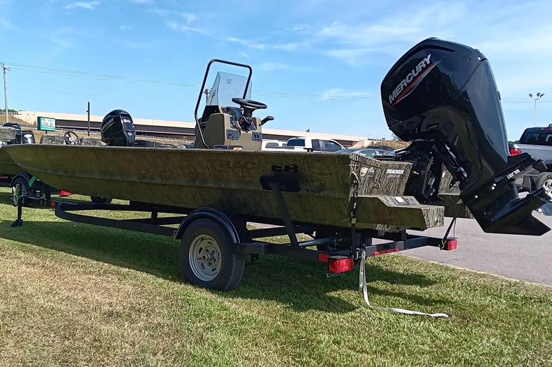 Slide: The Image of 2026 Tracker Grizzly 1860 CC boat with Mercury outboard motor on trailer. - 4