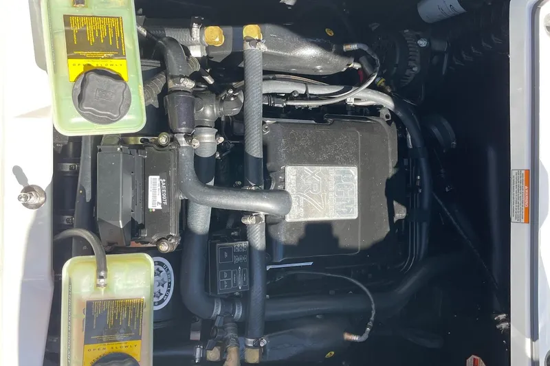 Slide: The Image of Engine compartment of a 2016 Nautique Super Air Nautique G21 boat. - 14