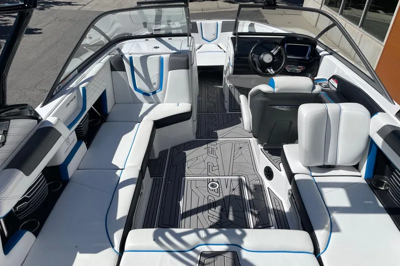 Slide: The Image of 2016 Nautique Super Air Nautique G21 interior with sleek seating and modern dashboard design. - 5