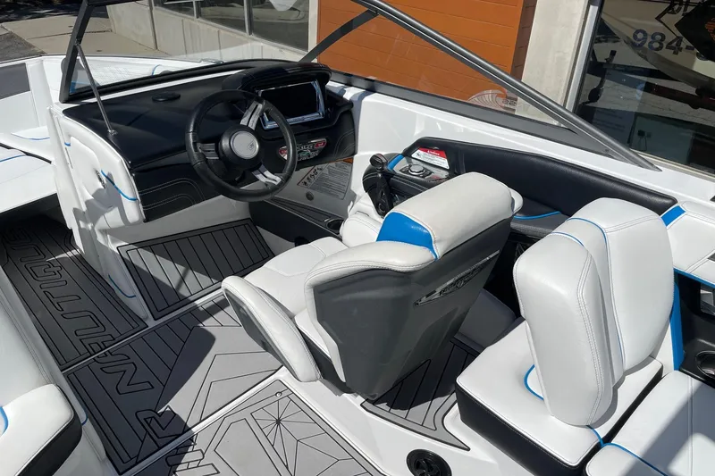 Slide: The Image of 2016 Nautique Super Air Nautique G21 interior with sleek design and modern dashboard. - 6