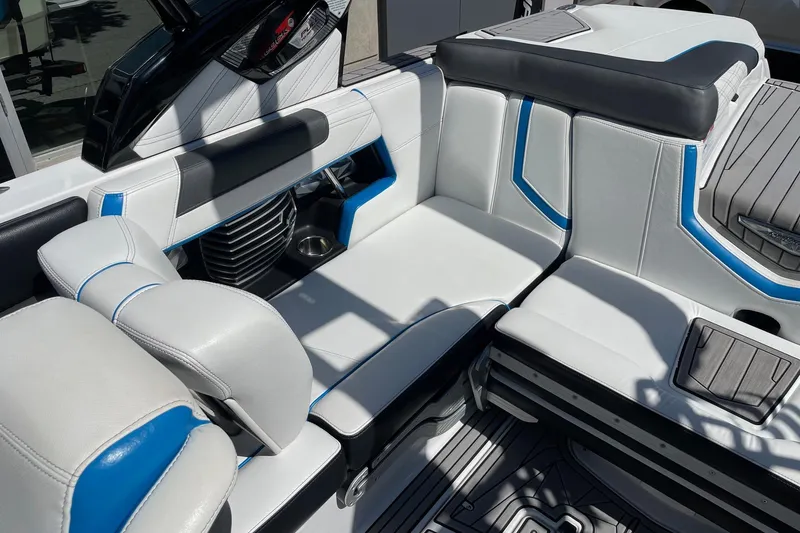 Slide: The Image of 2016 Nautique Super Air Nautique G21 interior with white and blue seating. - 7