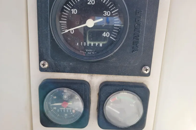 Slide: The Image of Yanmar engine gauges on a 2002 Beneteau Oceanis 311 sailboat dashboard. - 13