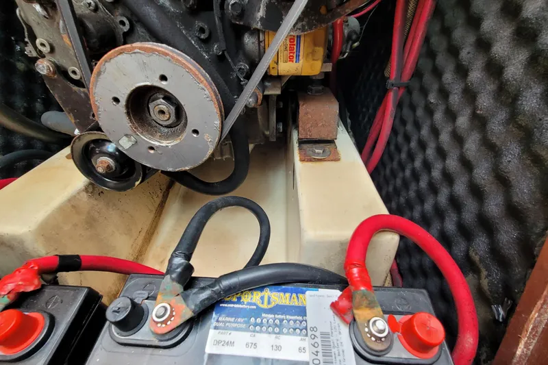 Slide: The Image of Engine compartment of 2002 Beneteau Oceanis 311 sailboat with visible battery connections. - 38