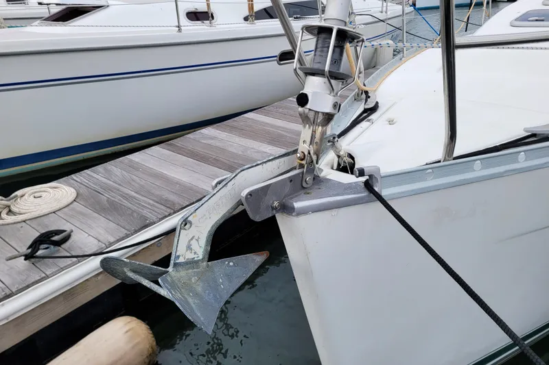 Slide: The Image of Bow of 2002 Beneteau Oceanis 311 sailboat with anchor at dock. - 9