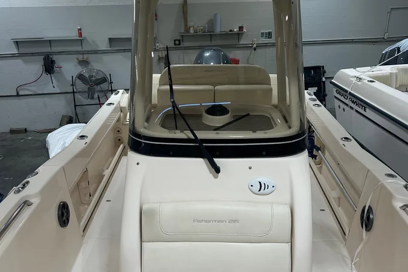 Slide: The Image of 2021 Grady-White Fisherman 216 boat interior in a garage setting. - 3