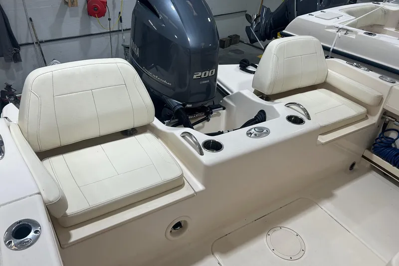 Slide: The Image of 2021 Grady-White Fisherman 216 boat interior with Yamaha 200 engine and cushioned seating. - 5