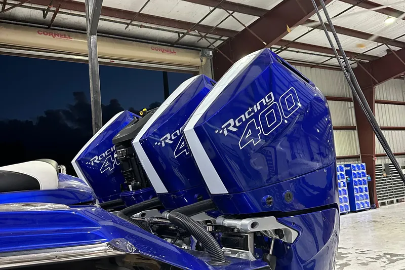 Slide: The Image of Blue Nor-Tech 390 Sport 2025 with Racing 400 engines in a warehouse setting. - 17