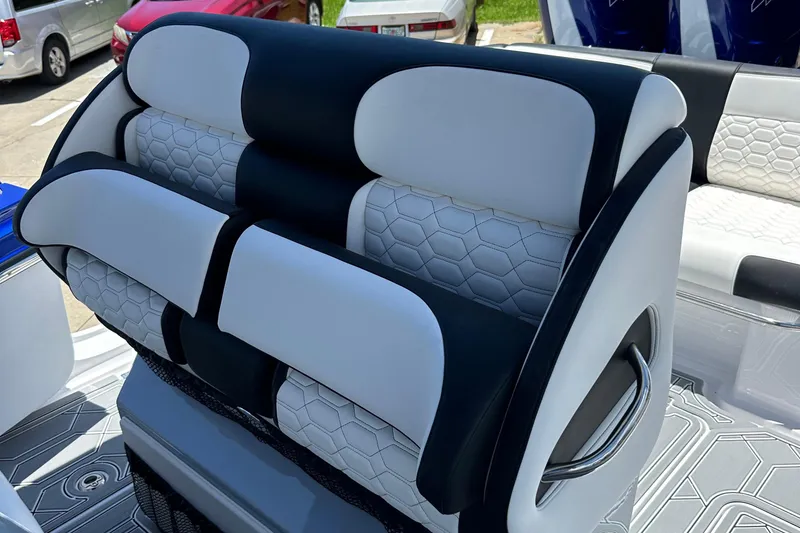 Slide: The Image of Luxury seating on 2025 Nor-Tech 390 Sport boat with hexagonal pattern upholstery. - 26