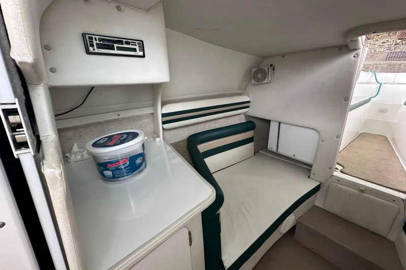 Slide: The Image of 1999 Envision 3200 Intruder cabin interior with seating and storage area. - 18