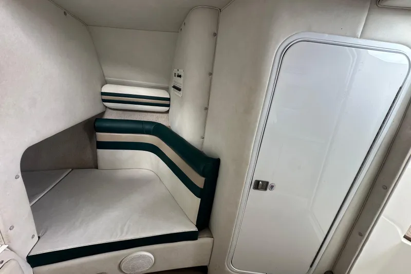 Slide: The Image of 1999 Envision 3200 Intruder cabin interior with white and green seating. - 19