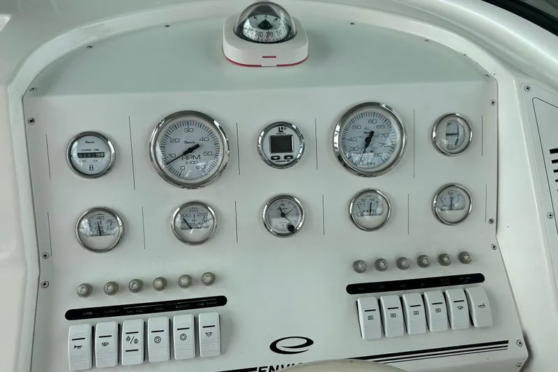 Slide: The Image of 1999 Envision 3200 Intruder dashboard with gauges and controls, featuring a compass. - 29