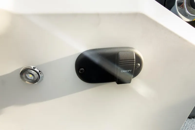 Slide: The Image of Control panel with canopy switch on 2026 Godfrey Sweetwater Xperience 22' Tritoon. - 19