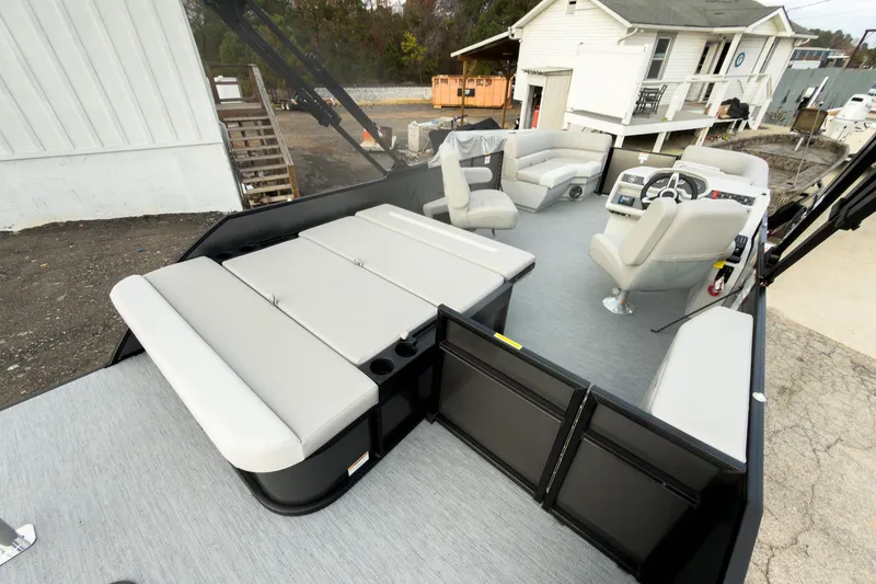 Slide: The Image of 2026 Godfrey Sweetwater Xperience 22' Tritoon with spacious seating and modern helm design. - 27