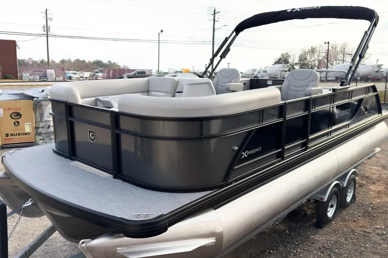 Slide: The Image of 2026 Godfrey Sweetwater Xperience 22' Tritoon with single flip lounge, parked outdoors. - 7