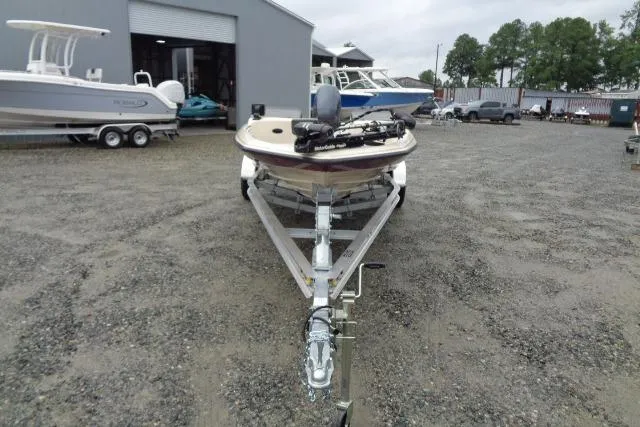 Slide: The Image of 1996 Quantum 180 XD boat on trailer in outdoor storage area. - 3