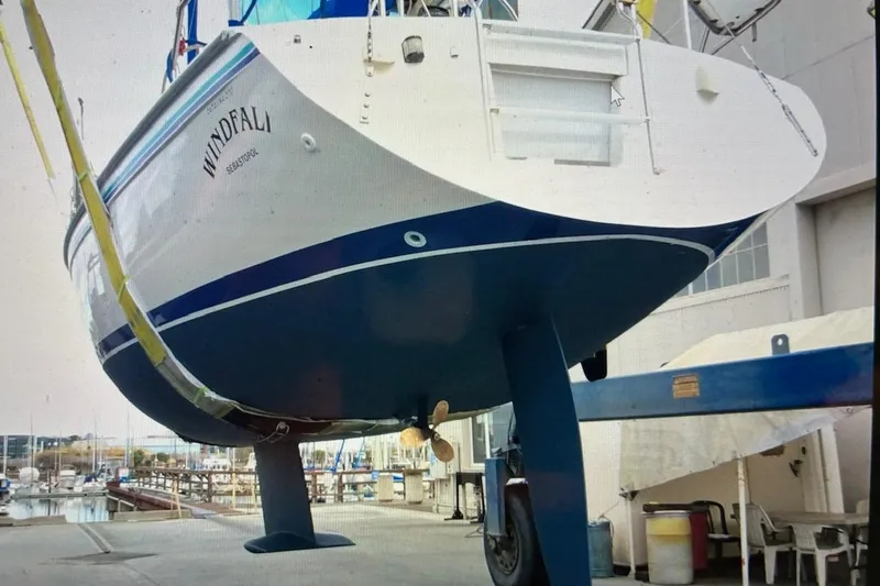 Slide: The Image of 1995 Catalina 270 sailboat in dry dock, showing hull and keel. - 17