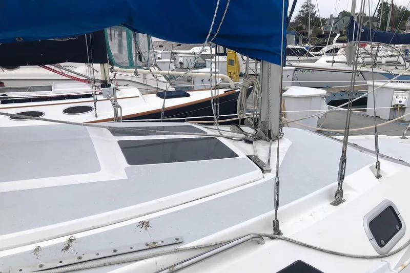 Slide: The Image of Interior of 1995 Catalina 270 sailboat with cozy seating and wooden table. - 3