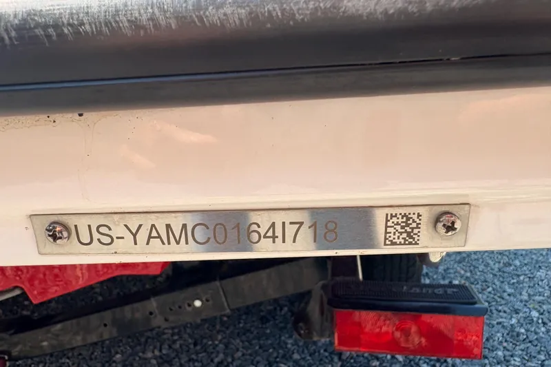 Slide: The Image of 2018 Yamaha Boats SX210 hull identification number plate with QR code. - 11
