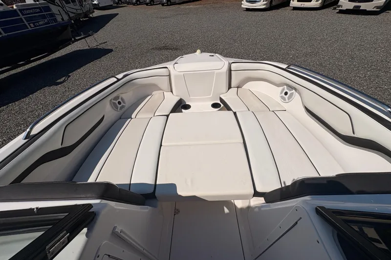 Slide: The Image of 2018 Yamaha Boats SX210 interior with spacious seating and sleek design. - 14