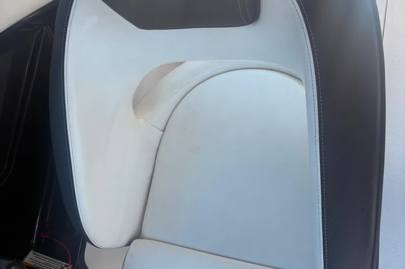 Slide: The Image of 2018 Yamaha SX210 boat seat with white and black upholstery. - 18