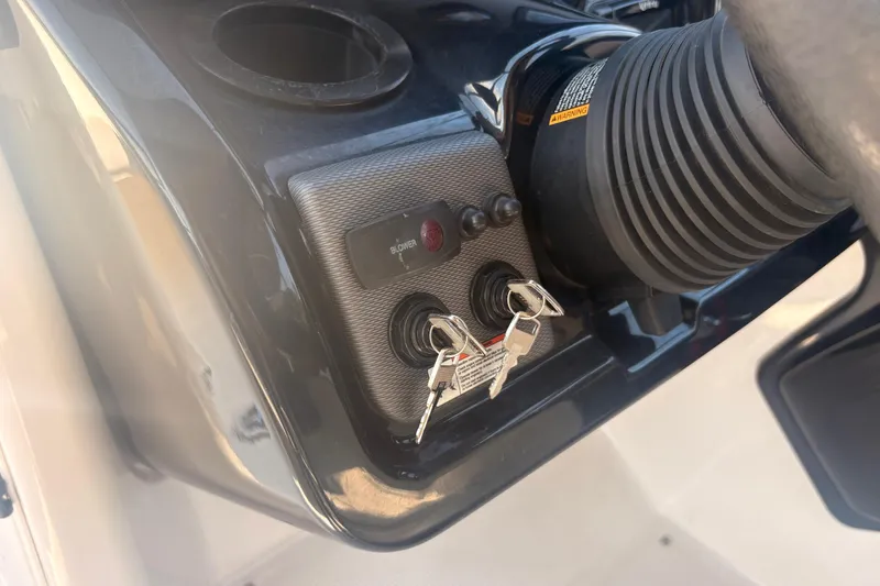 Slide: The Image of 2018 Yamaha SX210 boat ignition panel with keys and blower switch. - 23