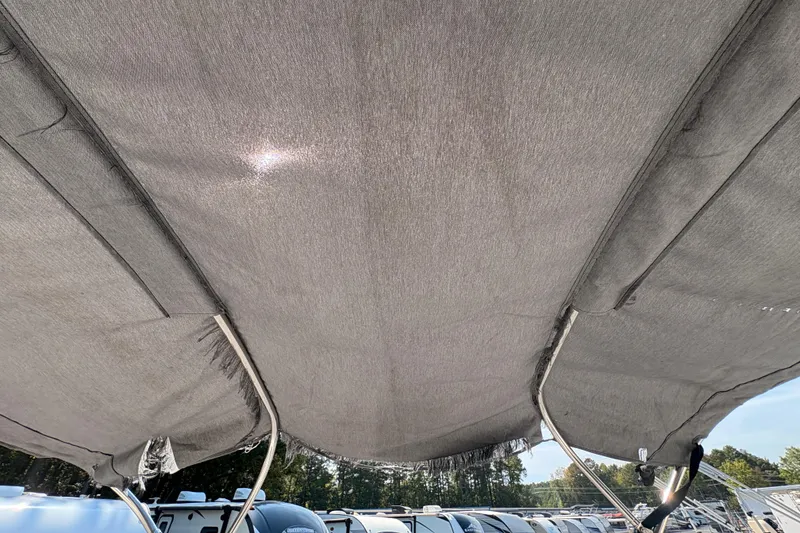 Slide: The Image of 2018 Yamaha SX210 boat canopy with sunlight filtering through, showcasing outdoor setting. - 25