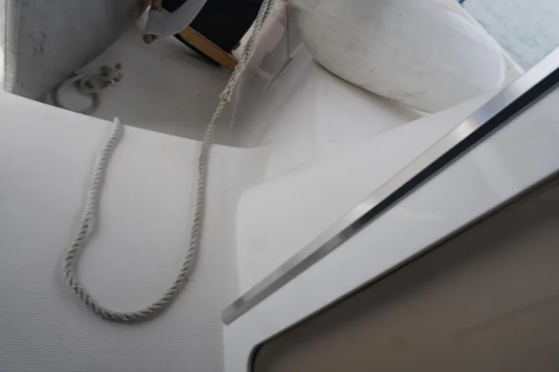 Slide: The Image of Deck view of 2006 Hunter 41 Deck Salon sailboat with rope and fender. - 10